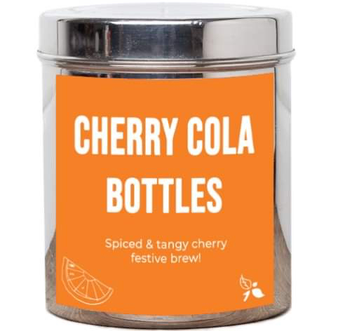 A short cylindrical silver metal tin with a bright orange label that has bird & blend tea company Cherry Cola Bottles Loose Leaf Tea written in bold white writing on it, on a white background.
