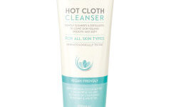 A tall conical white plastic tube with a bright white lid that has Aldi Lacura Original Hot Cloth Cleanser written in light blue writing and a picture of a light blue strip on it, on a white background.