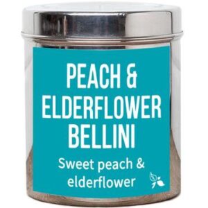 A short cylindrical silver metal tin with a light blue label that has bird & blend tea company Peach & Elderflower Bellini Loose Leaf Tea written in bold white writing on it, on a white background.