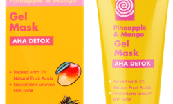 A short conical yellow plastic tube with a yellow plastic lid that has T-Zone Pineapple & Mango AHA Detox Gel Mask written in bright pink writing on it, on a white background.