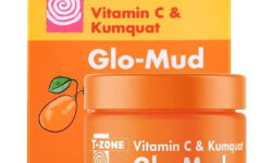 A short cylindrical clear glass jar full of some bright orange liquid with a bright orange plastic lid that has T-Zone Vitamin C & Kumquat written in bright orange writing and Glow Mud written in bold white writing on it, on a white background.