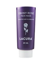 She Shall Indeed Grow In Grace And Beauty | Aldi Lacura Ebony Rose Face Mask A short conical dark purple plastic tube with a bright white lid that has Aldi Lacura Ebony Rose Face Mask written in bold white writing and a picture of a bright white rose on it, on a white background.