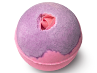 A large spherical shaped gradient bright pink and purple bath bomb that has some petal shaped pieces of rice paper embedded in the top of it, on a white background.