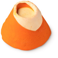 A short dark orange volcano shaped bubble bar that has a rim of bright yellow Cocoa butter around the top of it and is covered in some dark orange lustre, on a white background.