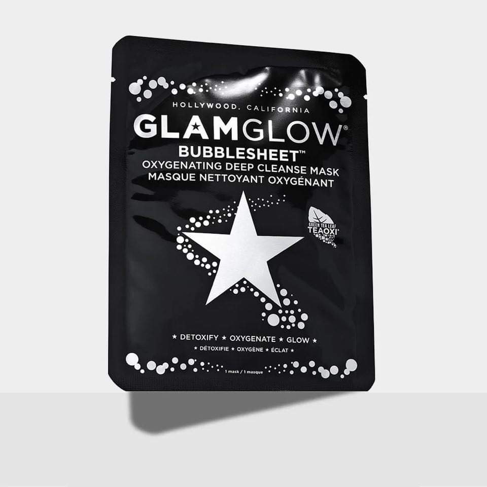 Cleansing With Bubbles Always Makes Me Feel Glamorous | GlamGlow BubbleSheet™ Oxygenating Deep Cleanse Mask A tall rectangular black plastic pouch that has GlamGlow BubbleSheet™ Oxygenating Deep Cleanse Mask written in bold silver writing and a picture of a silver star on it, on a white background.