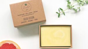 A large rectangular light brown block of solid lotion, on a white background.