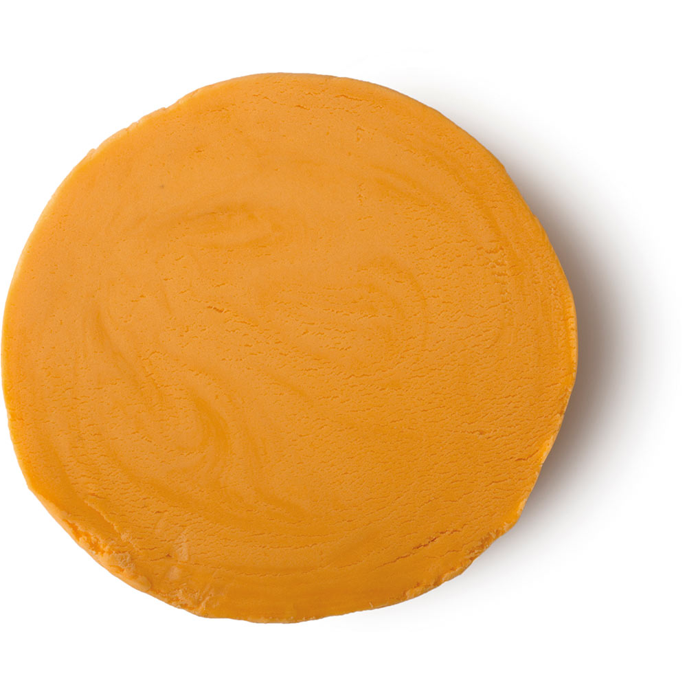 You've Got Chocolate All Around Your Mouth | Superdrug Skin Rescue Chocolate Orange Self-Heating Mask A large cylindrical block of bright orange plasticine, on a white background.