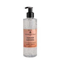 A tall cylindrical clear plastic bottle full of some translucent pink liquid with a black plastic pump lid and a bright pink label that has The Yorkshire Soap Company Summer Sangria Alcohol Hand Gel written in bold black writing on it, on a white background.