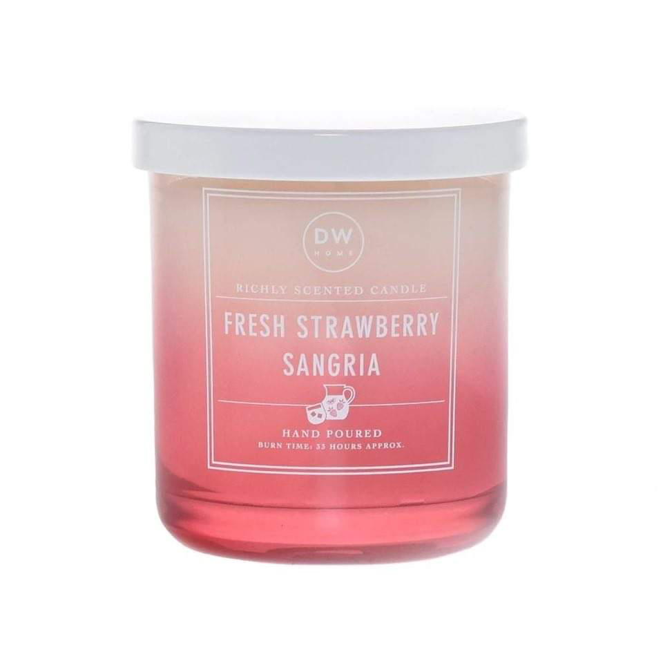 Sipping A Nice Glass Of Sangria At Home | DW Home Candles Fresh Strawberry Sangria A short cylindrical clear glass Jar full of some bright pink wax with a bright pink label that has DW Home Candles Fresh Strawberry Sangria written in bold white writing and a picture of a white Flamingo on it, on a white background.