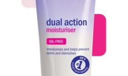 A short conical white plastic tube with a dark purple Lid and a faded dark purple label that has Clean & Clear written in bright pink writing and Dual Action Moisturiser written in bright blue writing on it, on a white background.
