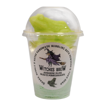 I Think That There's Some Witches Flying Around Yorkshire Tonight | The Yorkshire Soap Company Halloween 2021 Range A tall cylindrical clear plastic cup full of some bright green powder with a clear plastic dome lid and a white label that has The Yorkshire Soap Company Witches Brew Shake, Bubble & Bathe written in bold black writing and a picture of a woman wearing a witches outfit on it, on a white background.