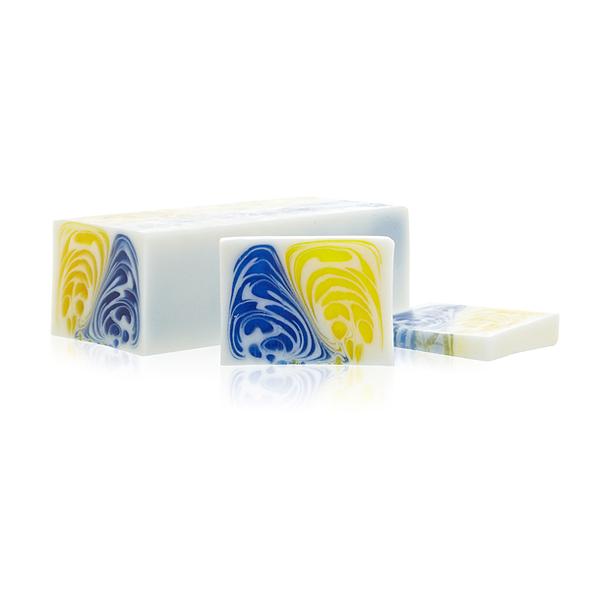 Waking My Beard Up With A Nice Cup Of Tea In The Morning | Man Made Beard Company Jasmine & Green Tea Soap | Gifted A large rectangular block of bright white soap that has a bright blue and yellow swirl in the middle of it, on a white background.