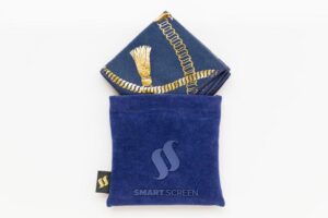 A large rectangular piece of dark blue material that has a gold chain design embossed on it inside a light blue cloth bag that has Smart Screen written in dark blue writing on it, on a white background.