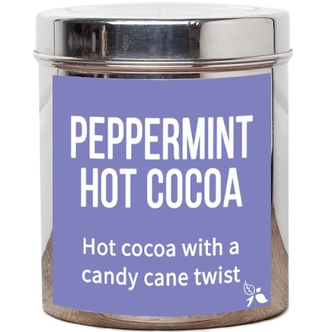 A short cylindrical silver metal tin with a dark purple label that has bird & blend tea company Peppermint Hot Cocoa Loose Leaf Tea written in bold white writing on it, on a white background.