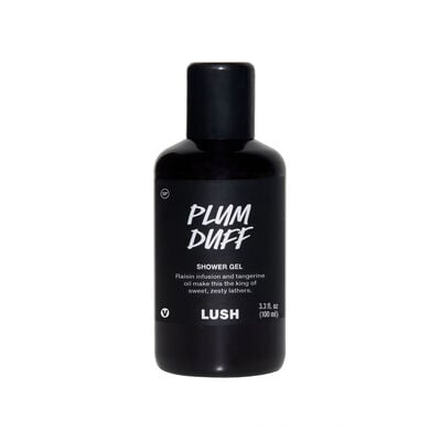 Purple Rain, Purple Rain | Lush Plum Rain Shower Gel & Plum Rain Body Spray A tall cylindrical clear plastic bottle full of some light purple liquid with a white label that has Lush Plum Duff Shower Gel written in bold black writing on it, on a white background.