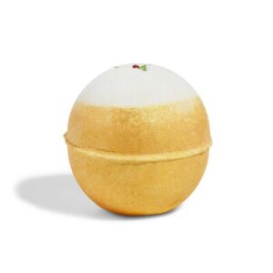 A large bright gold rounded hexagonal shaped bath bomb that has a freeze-dried holly leaf embedded in the top of it and some gold lustre on it, on a white background.