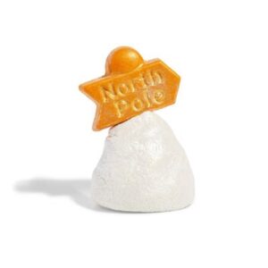 A small bright white oval shaped bubble bar that has a bright gold rectangular shaped block of solid oil with North Pole engraved on it coming out of the top of it, on a white background.