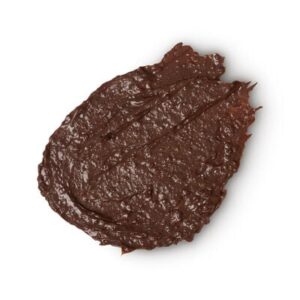 A medium circular puddle of dark brown body wash, on a white background.