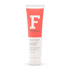 The Soothing Technologie Of Moro Orange | Farmologie Moro Orange Moisturiser A tall conical white plastic tube that has Farmologie Moro Orange Moisturiser written in bold black writing, a picture of a large white letter f, and a pink stripe on it, on a white background.