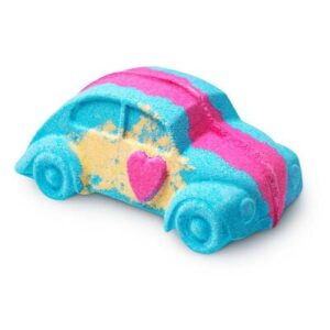 a large light blue car shaped bath bomb that has some stripes of bright pink and yellow and a large bright red love heart in the middle of it, on a white background.
