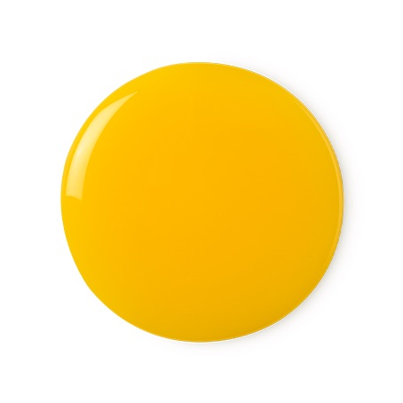 A medium circular puddle of some bright orange shower gel, on a white background.