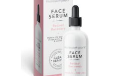 A short cylindrical white glass bottle with a black rubber pipette lid that has The Beauty Worx written in bold black writing and Retinol Recovery Face Serum written in bright pink writing on it next to a tall rectangular white cardboard box that has The Beauty Worx Retinol Recovery Face Serum written in bold black writing on it, on a white background.