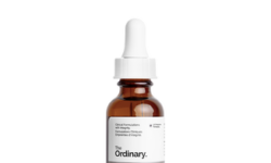 A short cylindrical brown glass bottle with a white rubber pipette lid and a white label that has The Ordinary Salicylic Acid 2% Anhydrous Solution written in bold black writing on it, on a white background.