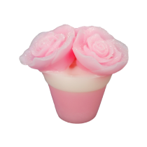 Giving My Mum A Bunch Of Yorkshire Roses For Mother’s Day | The Yorkshire Soap Company Mother's Day 2022 Range A short cylindrical gradient light pink and white flower pot shaped block of soap that has some large bright pink rose petals coming out of the top of it, on a white background.