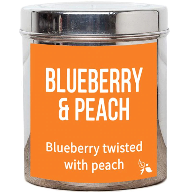 Tea Tastes Terrific | Bird & Blend Tea Company Blueberry & Peach Loose Leaf Tea A short cylindrical silver metal tin with a bright orange label that has Bird & Blend Tea Company Blueberry & Peach Loose Leaf Tea written in bold white writing on it, on a white background.