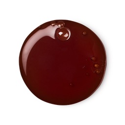 A medium circular puddle of light golden brown shower gel, on a white background.