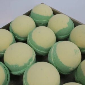 A large spherical shaped bright green Bath Bomb, on a white background.
