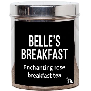 A short cylindrical silver metal tin with a black label that has bird & blend tea company Belle's Breakfast Loose Leaf Tea written in bold white writing on it, on a white background.