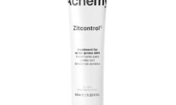 A tall thin conical White Plastic Tube with a bright yellow Lid that has Acnemy Zit Control® written in bold black writing on it, on a white background.