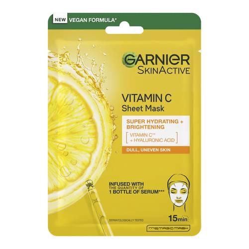 A tall rectangular white plastic pouch that has Garnier SkinActive Vitamin C Sheet Mask written in bold black writing and a picture of a bright yellow slice of Lemon on it, on a white background.