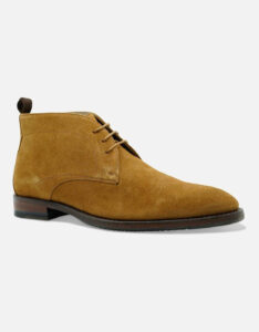 A pair of dark brown suede boots with some black soles and some light brown laces, on a white background.