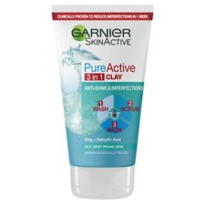 A tall conical white plastic tube with a White Plastic Lid that has Garnier written in bold black writing, Pure Active written in dark blue writing, Clay Wash Scrub Mask Oily Skin written in bright red writing, a picture of a dark blue stripe, and a picture of a puddle of water on it, on a white background.