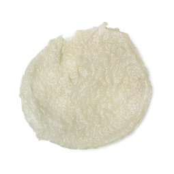 A medium circular puddle of some creamy white body scrub that has some pieces of Sea Salt running through it, on a white background.