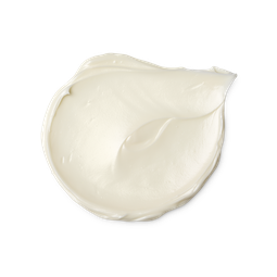 A medium circular puddle of some thick creamy white cleansing balm, on a white background.