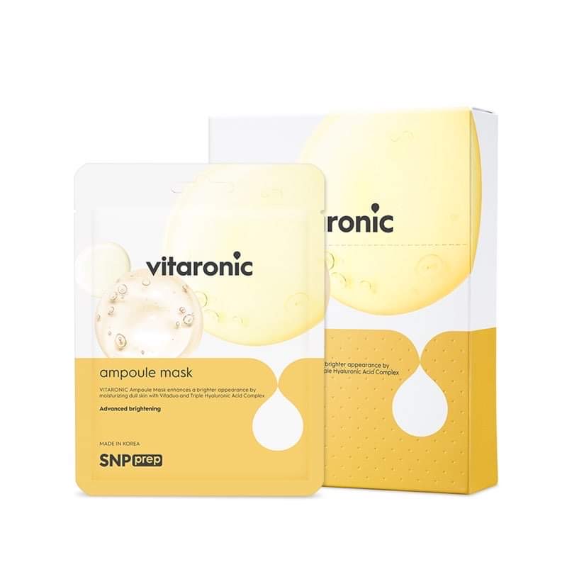It's Always Important To Include Vitamins In Your Skincare | SNP Prep Vitaronic Ampoule Mask A tall rectangular white plastic pouch that has SNP Prep Vitaronic Ampoule Mask written in bold black writing, a picture of a bright yellow stripe, and a picture of a pale yellow bubble on it, on a white background.