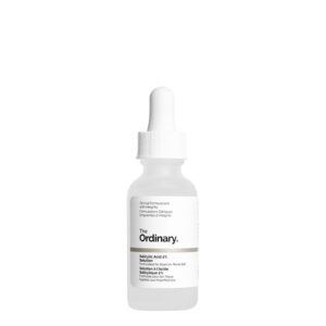 A short cylindrical clear glass Bottle with a white rubber pipette lid full of some bright white liquid with a white label that has the ordinary salicylic acid 2% solution written in bold black writing on it, on a white background.