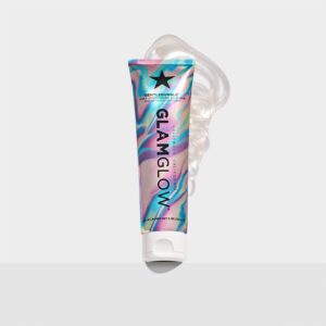 A tall conical metallic rainbow effect blue, Pink and purple plastic tube with a white plastic lid that has GlamGlow GentleBubble™ Daily Conditioning Cleanser written in bold black writing and a picture of a black star on it, on a white background.