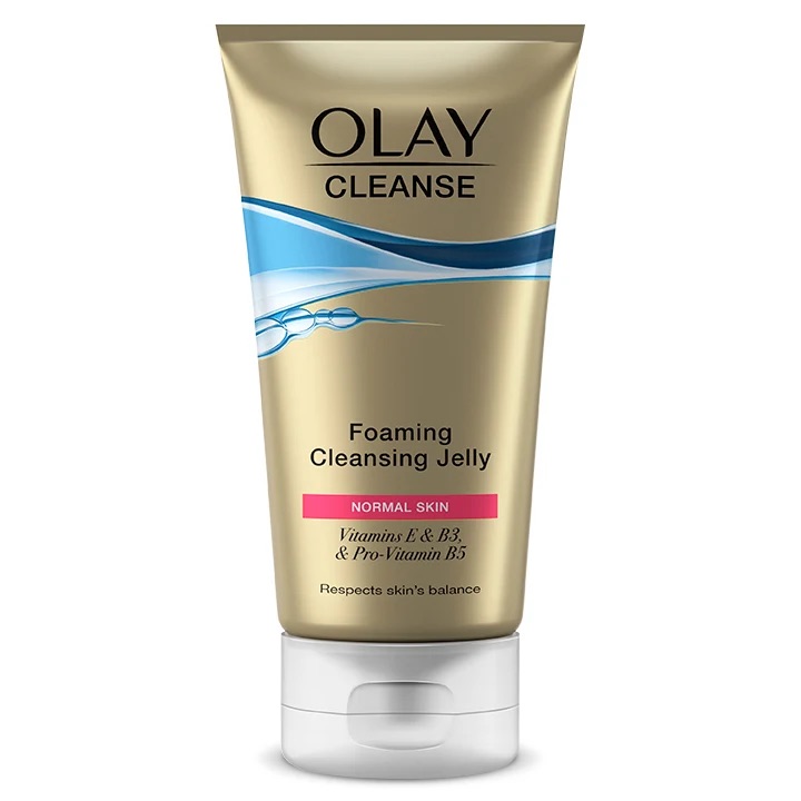 A tall conical bright yellow plastic tube with a clear plastic lid that has Olay Cleanse Foaming Cleansing Jelly written in bold black writing on it, on a white background.