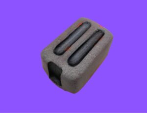 A large rectangular bright white toaster shaped bath bomb that has a black lever engraved on the side of it, on a white background.