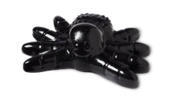 A large shiny Black tarantula shaped Block of Shower Jelly that has a smily face engraved on it, on a white background.