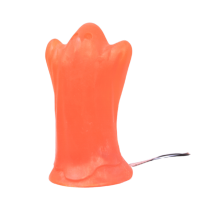 A large bright orange ghost shaped block of soap, on a white background.