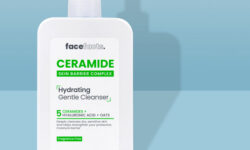 A tall rectangular white plastic bottle with a white plastic pump lid and a white label that has Face Facts Ceramide Hydrating Gentle Cleanser written in bold black writing on it, on a white background.