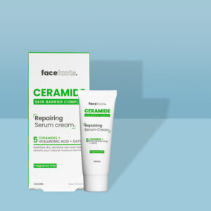 A short conical white plastic tube with a white plastic lid and a white label that has Face Facts Ceramide Repairing Serum Cream written in bold black writing on it next to a tall rectangular white cardboard box that has Face Facts Ceramide Repairing Serum Cream written in bold black writing on it, on a white background.