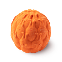 A large dark orange spherical shaped bath bomb that has some streaks of dark red and bright yellow all over it, on a white background.