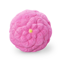 A large bright pink flower shaped bath bomb that has a bright yellow centre, on a white background.