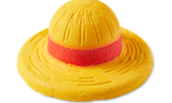 A large bright yellow straw hat shaped bubble bar that has a bright red brim, on a white background.